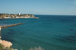 APARTAMENTO EN BAJO CON JARDIN Y PATIO EN LA PLAYA